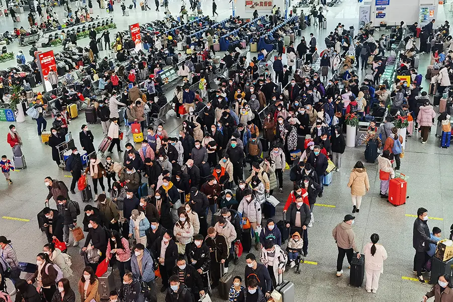 Crowd of travellers at Guangzhou South Railway Station, China